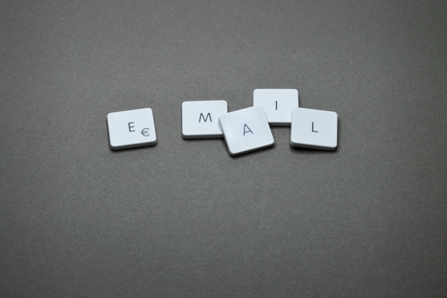 An open envelope with a letter, illustrating email contact